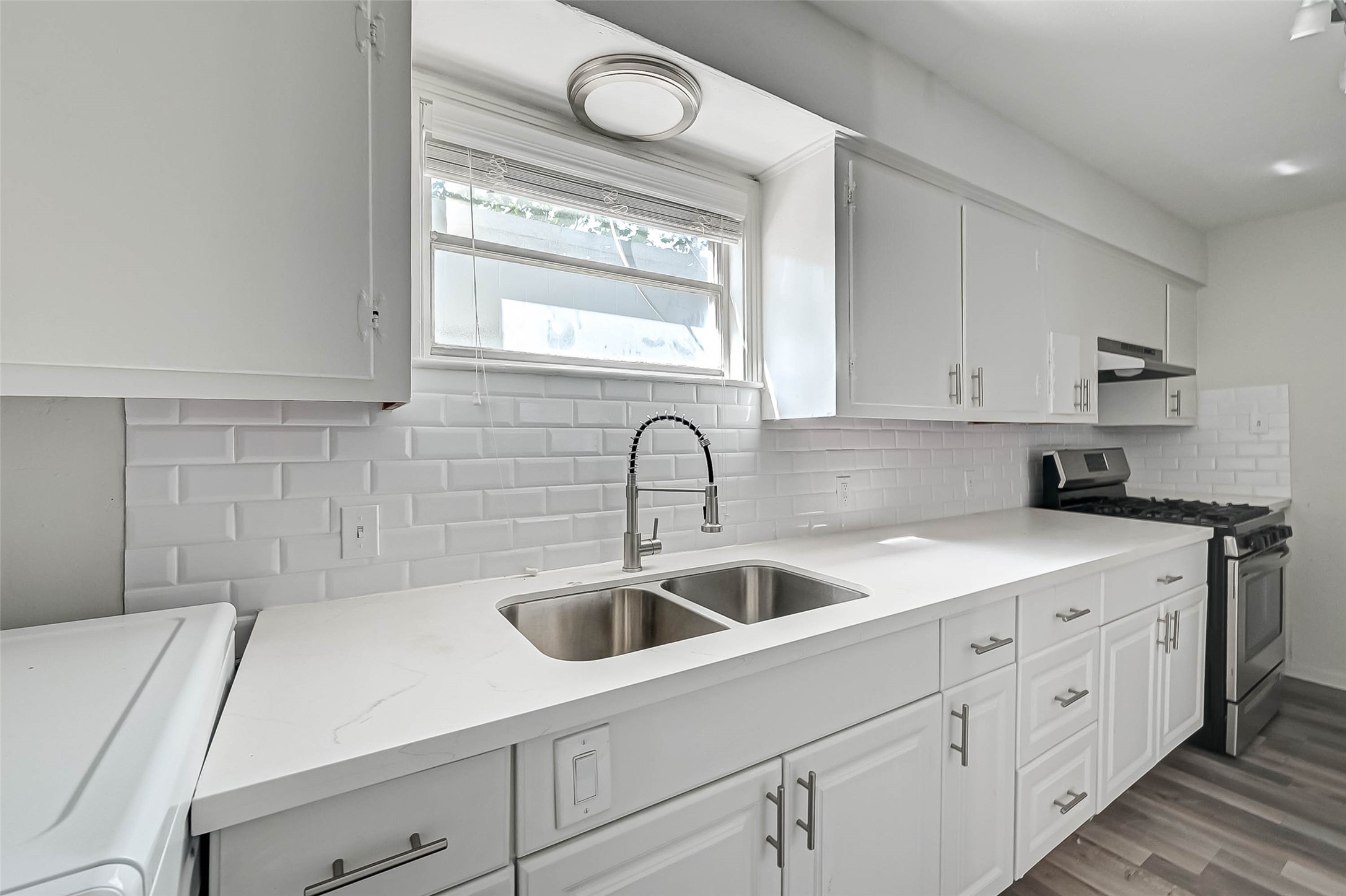 2420 McDuffie Street, Unit 1A Houston, TX 77019 - Photo 6 of 11 a kitchen with a sink and cabinets