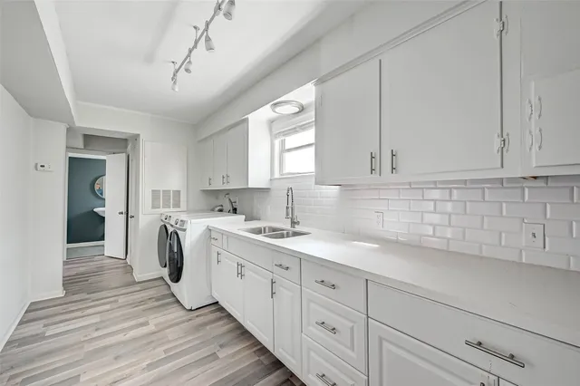 a kitchen with sink cabinets and window