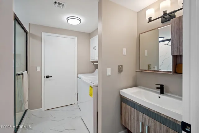 a bathroom with a sink and a mirror