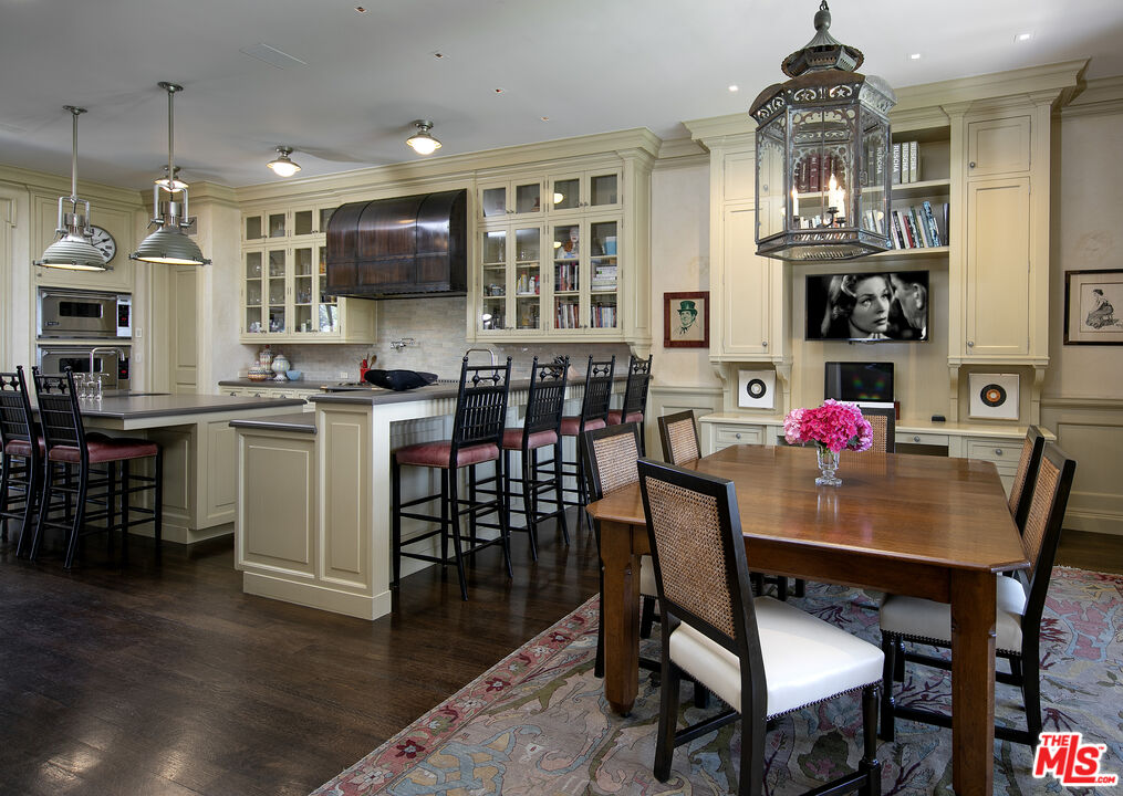 10702 Levico Way Los Angeles, CA 90077 - Photo 17 of 35 a view of a dining room with furniture and wooden floor