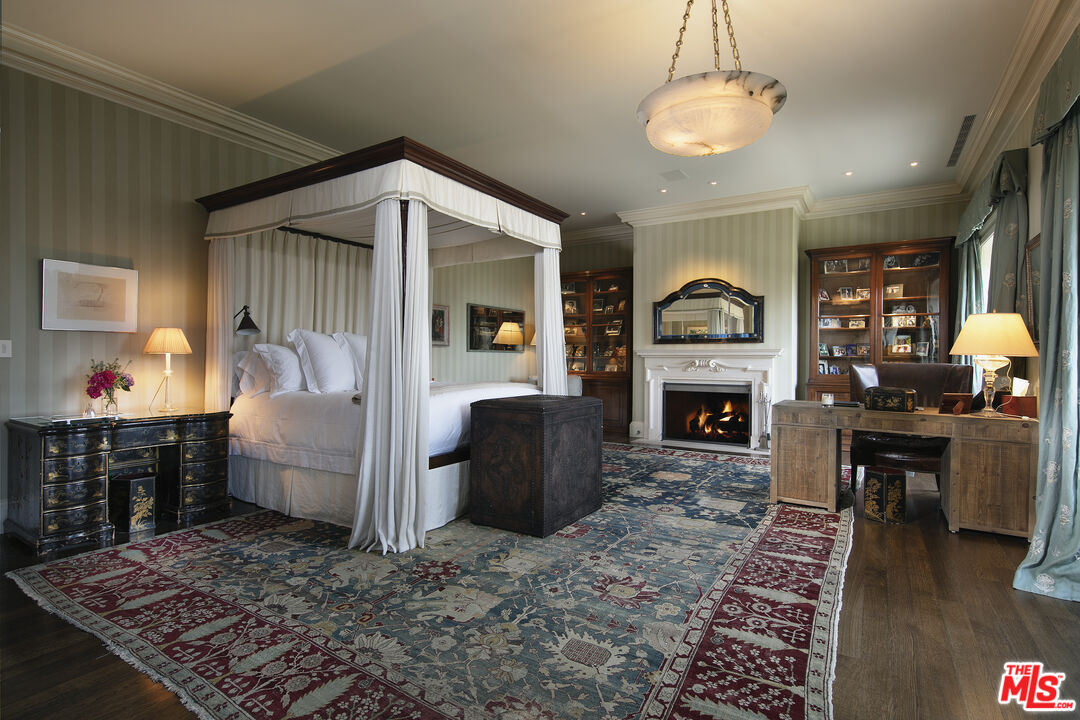 10702 Levico Way Los Angeles, CA 90077 - Photo 20 of 35 a living room with furniture and a fireplace