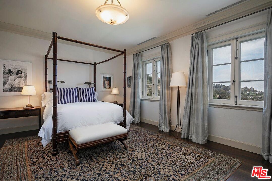 10702 Levico Way Los Angeles, CA 90077 - Photo 22 of 35 a bedroom with a bed and window