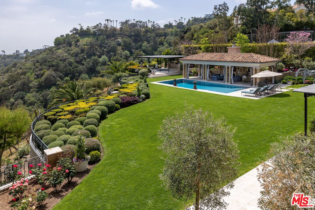 10702 Levico Way Los Angeles, CA 90077 - Photo 24 of 35 a view of a house with a big yard