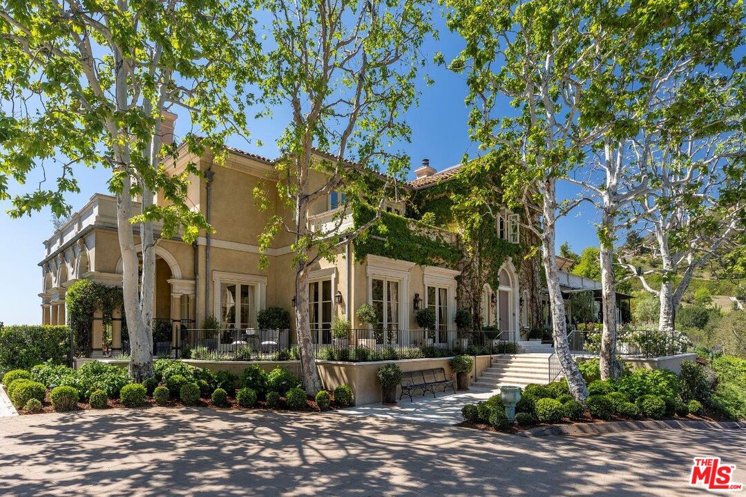 10702 Levico Way Los Angeles, CA 90077 - Photo 6 of 35 a view of a building with a tree