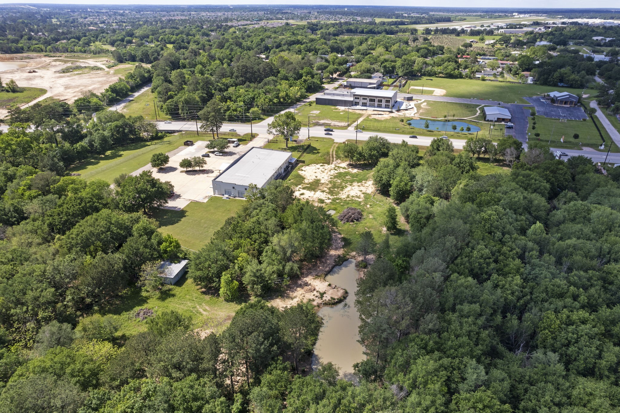 7803 Spring Cypress Road Spring, TX 77379 - Photo 2 of 15 an aerial view of residential houses with outdoor space and river
