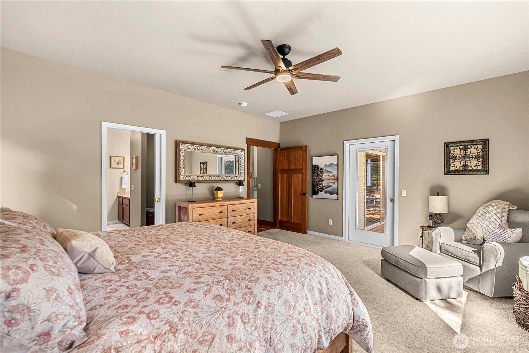 6533 Forest Ridge Drive Wenatchee, WA 98801 - Photo 20 of 37 a bedroom with a large bed and a chandelier