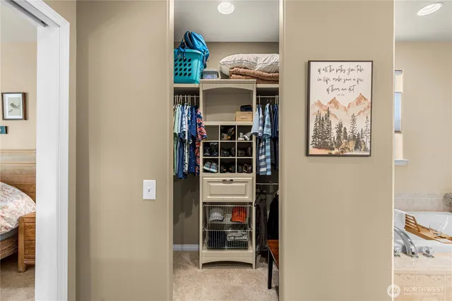 a spacious bathroom with a mirror sink and shower