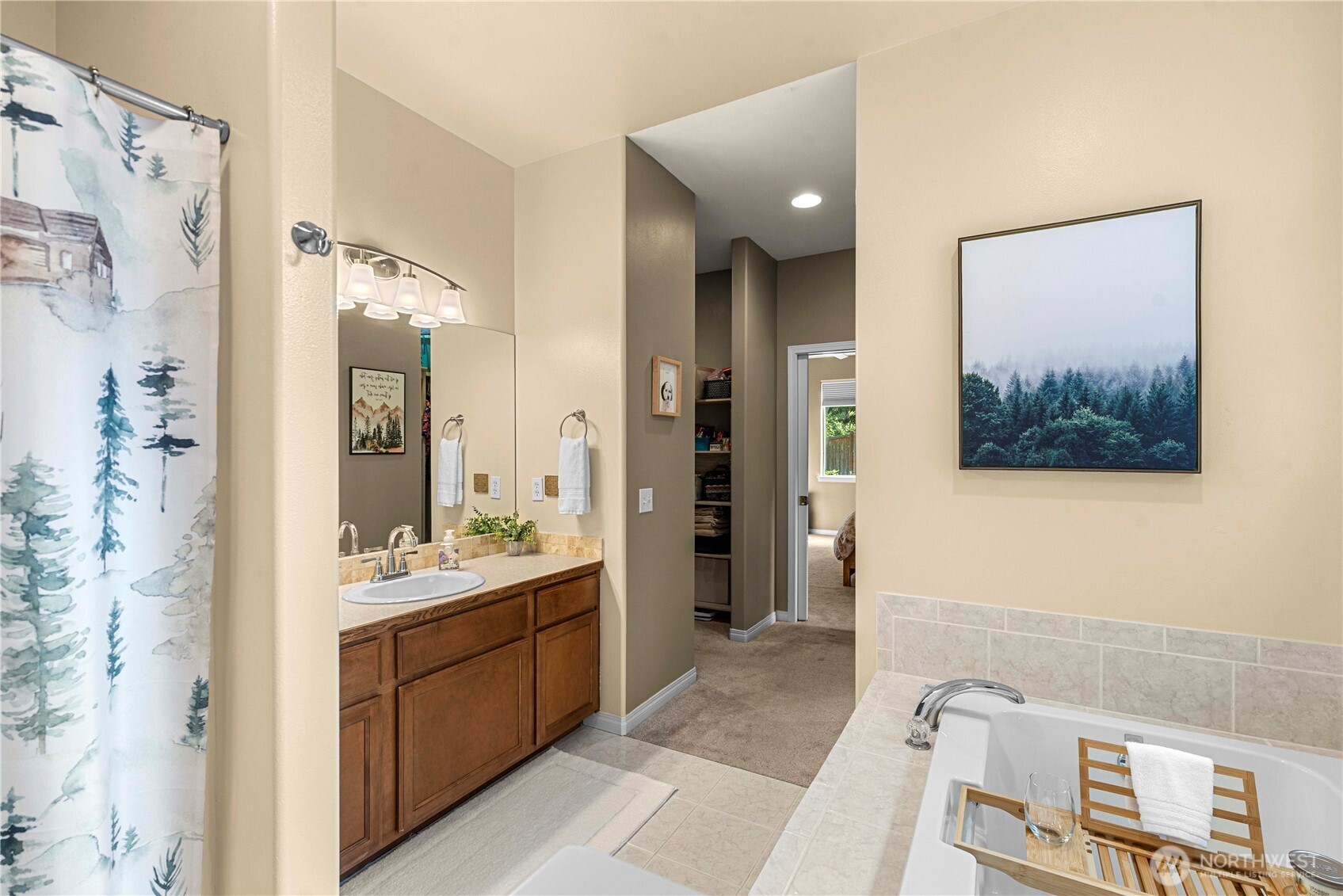 6533 Forest Ridge Drive Wenatchee, WA 98801 - Photo 23 of 37 a spacious bathroom with a mirror sink and shower