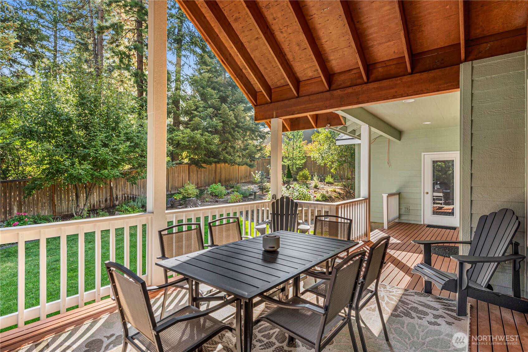 6533 Forest Ridge Drive Wenatchee, WA 98801 - Photo 30 of 37 a view of a patio with a table chairs and a backyard
