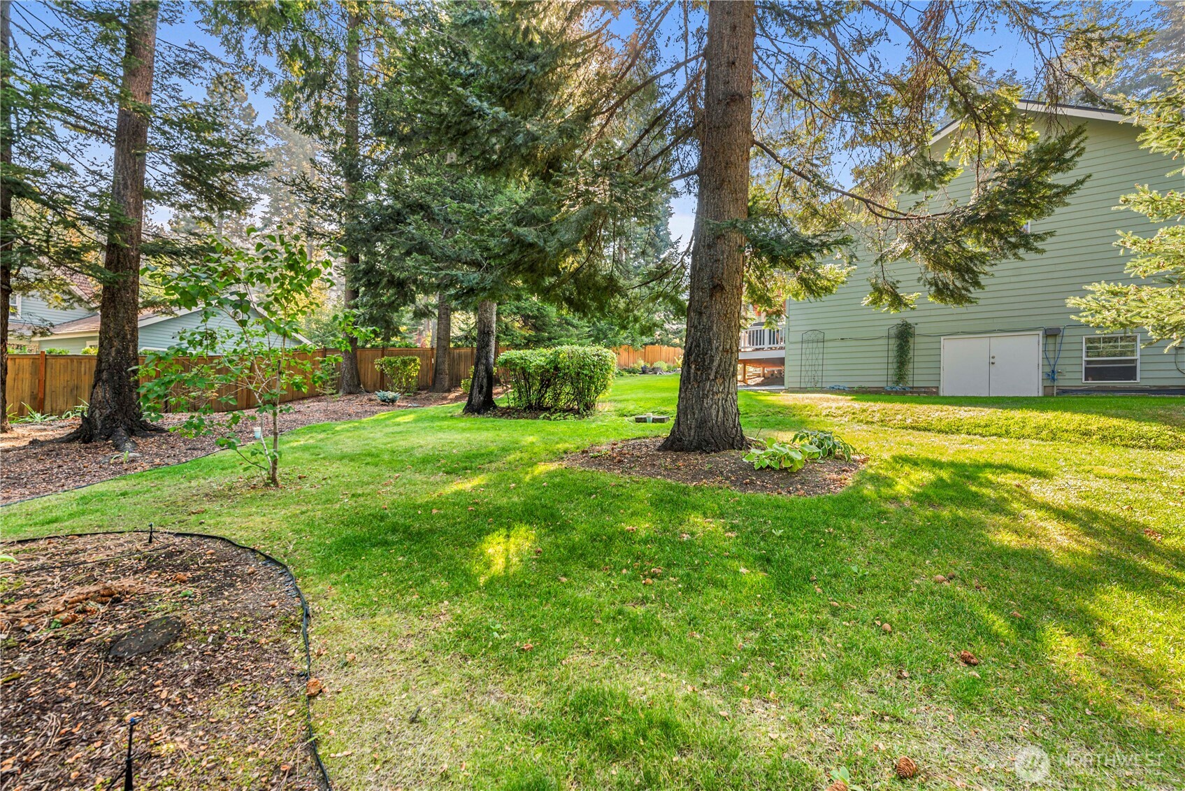 6533 Forest Ridge Drive Wenatchee, WA 98801 - Photo 37 of 37 a view of a backyard with large trees and a small yard