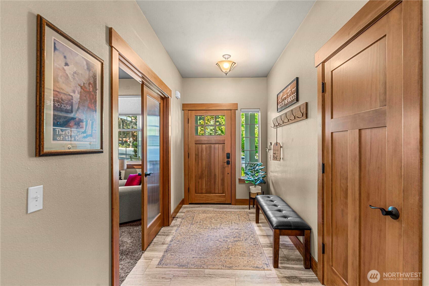 6533 Forest Ridge Drive Wenatchee, WA 98801 - Photo 7 of 37 a view of a hallway with wooden floor and windows