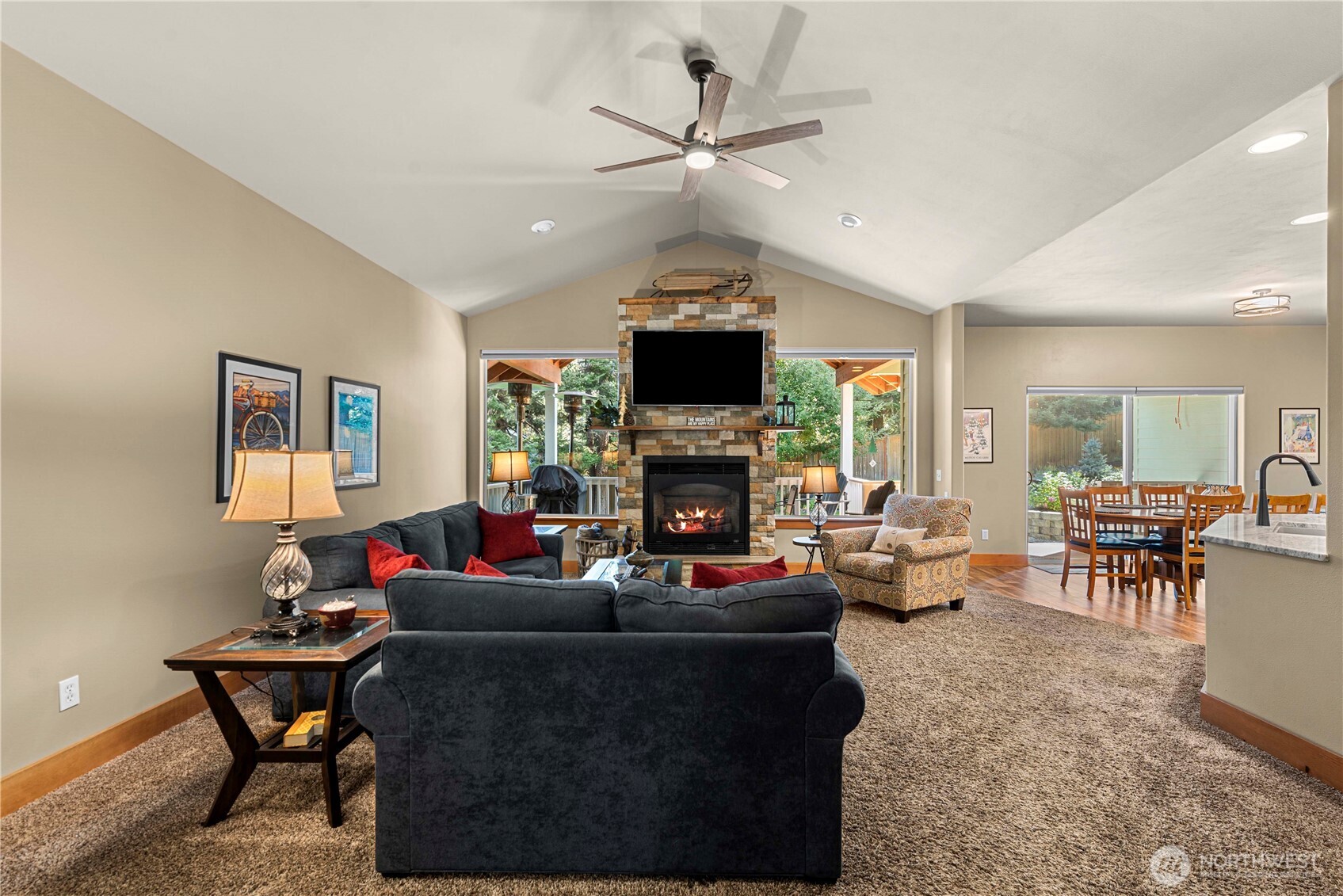 6533 Forest Ridge Drive Wenatchee, WA 98801 - Photo 10 of 37 a living room with furniture a fireplace and a flat screen tv