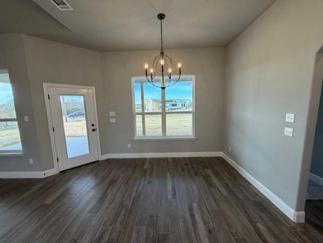 202 Coalson Crossing Azle, TX 76020 - Photo 11 of 23 wooden floor in an empty room with a window