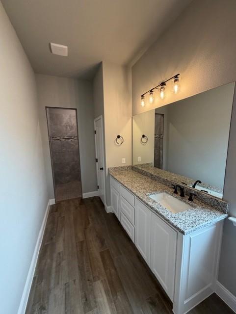 202 Coalson Crossing Azle, TX 76020 - Photo 16 of 23 a bathroom with a granite countertop sink and a mirror