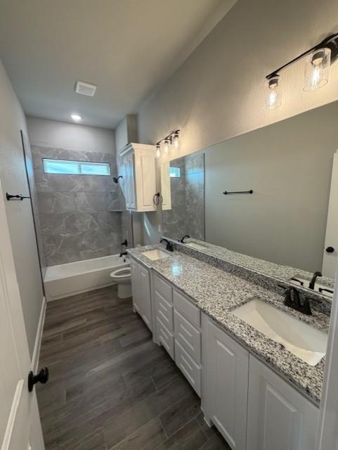202 Coalson Crossing Azle, TX 76020 - Photo 21 of 23 a bathroom with a granite countertop sink mirror vanity and toilet