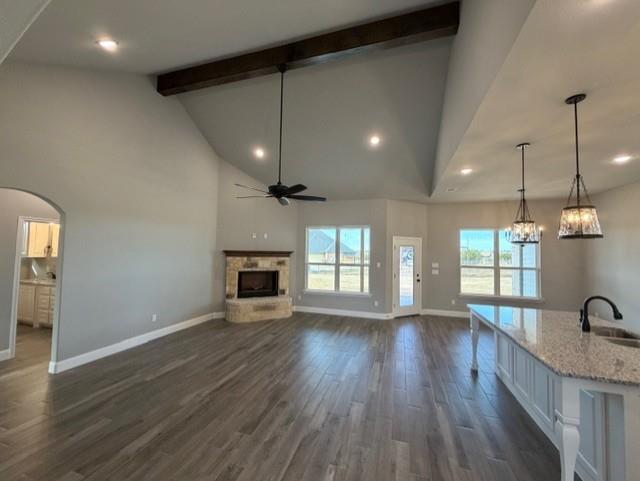 202 Coalson Crossing Azle, TX 76020 - Photo 7 of 23 an empty room with wooden floor and a fireplace