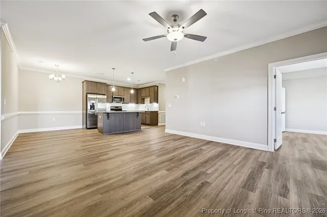 a view of a kitchen with a stove cabinets and wooden floor