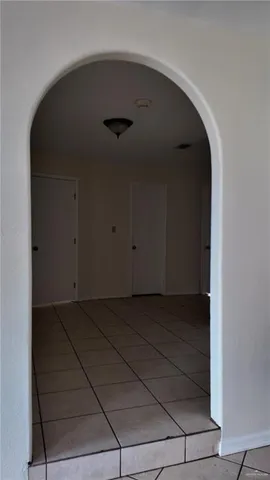 a view of a livingroom with a ceiling fan and window