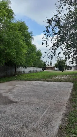 a view of a house with a tree beside it