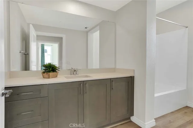 a bathroom with a sink and mirror