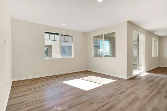 an entryway to room with windows