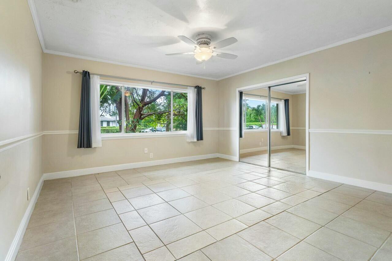 121 Northeast Spanish Court Boca Raton, FL 33432 - Photo 16 of 36 a view of an empty room with a window
