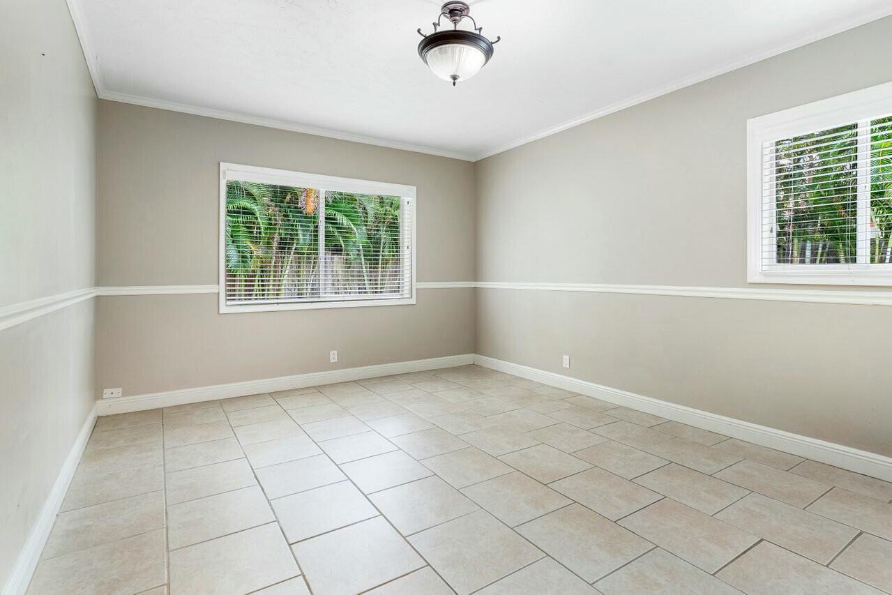 121 Northeast Spanish Court Boca Raton, FL 33432 - Photo 20 of 36 a view of an empty room with a window