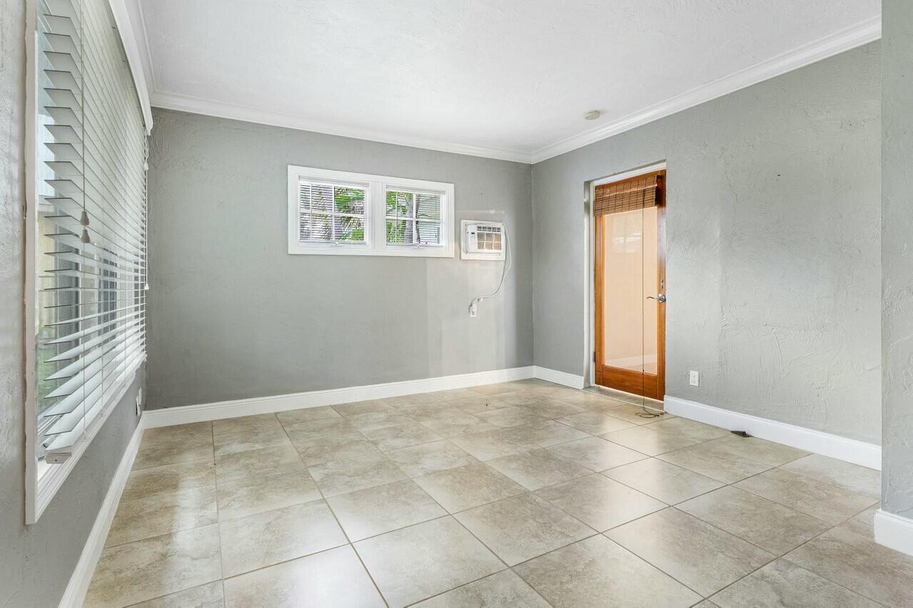 121 Northeast Spanish Court Boca Raton, FL 33432 - Photo 23 of 36 a view of an empty room with a window