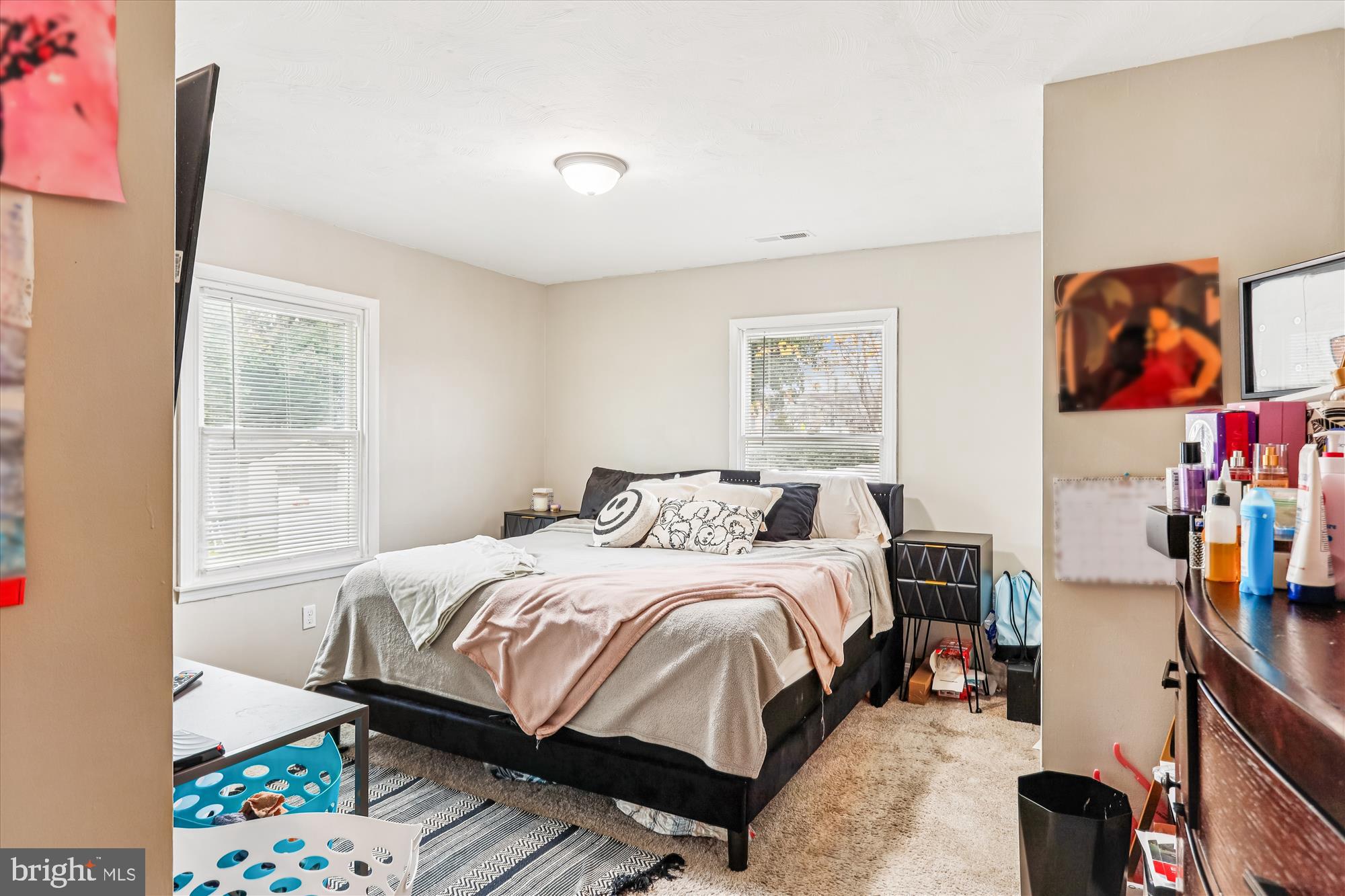 5706 Johnson Street Baltimore, MD 21225 - Photo 11 of 20 a bedroom with a bed and a window