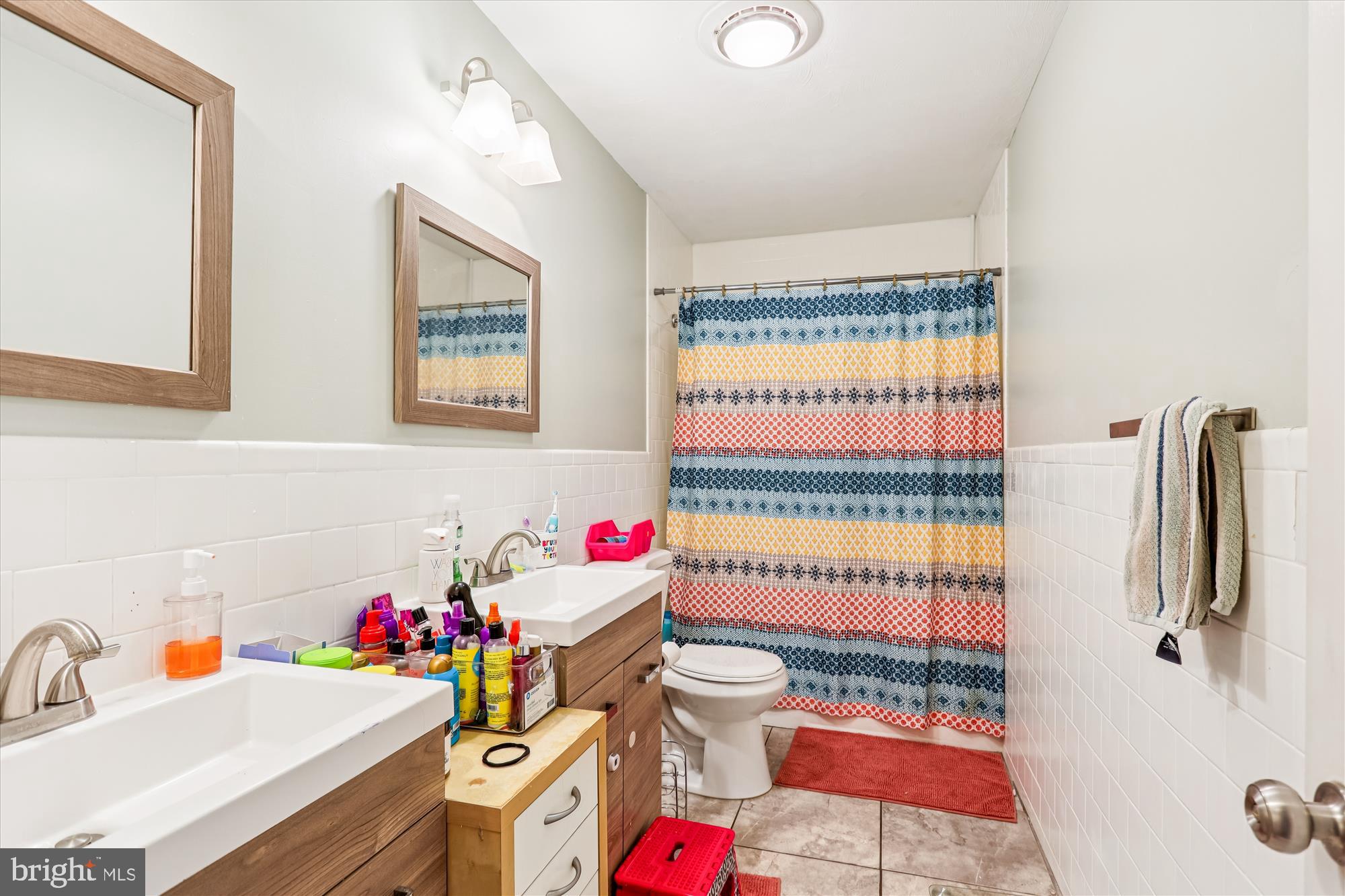 5706 Johnson Street Baltimore, MD 21225 - Photo 16 of 20 a bathroom with a sink toilet and shower