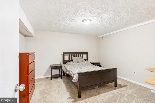 a bedroom with a bed and a table in it