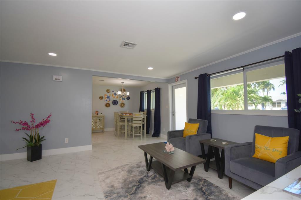 214 Southeast 5th Street Dania Beach, FL 33004 - Photo 11 of 50 a living room with furniture and flowers