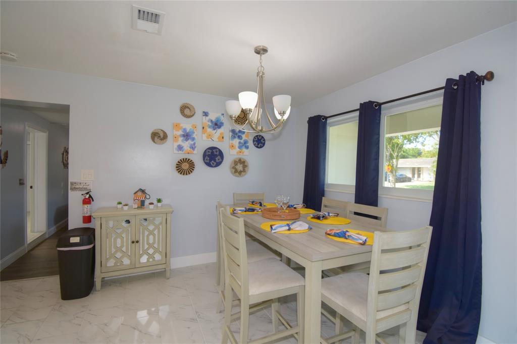 214 Southeast 5th Street Dania Beach, FL 33004 - Photo 12 of 50 a dining room with a table and chairs