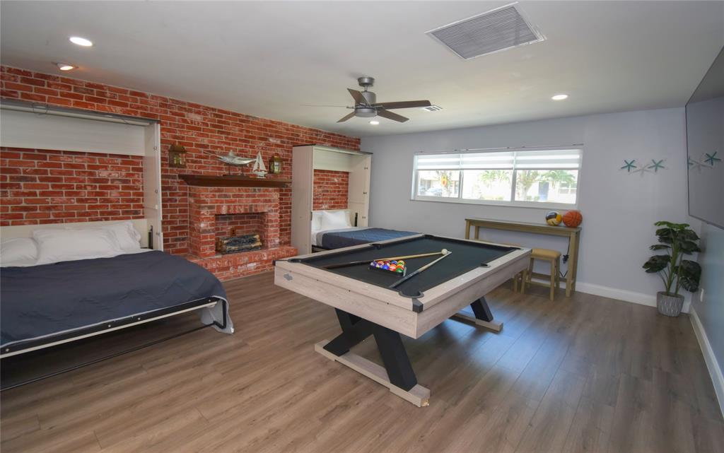 214 Southeast 5th Street Dania Beach, FL 33004 - Photo 19 of 50 a living room with furniture and a wooden floor