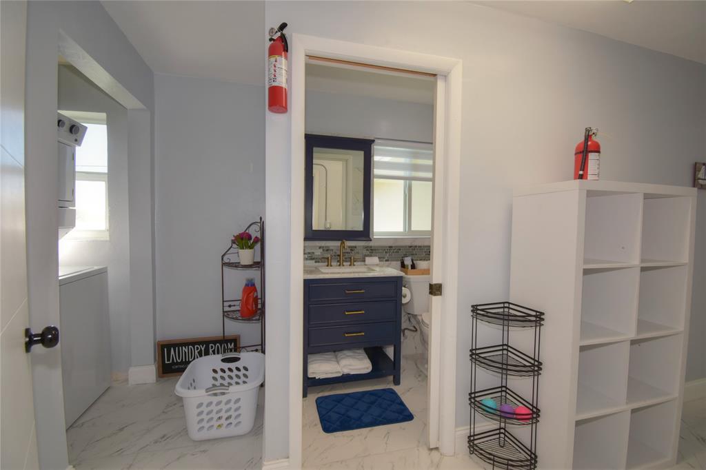 214 Southeast 5th Street Dania Beach, FL 33004 - Photo 23 of 50 a bathroom with a sink and a mirror