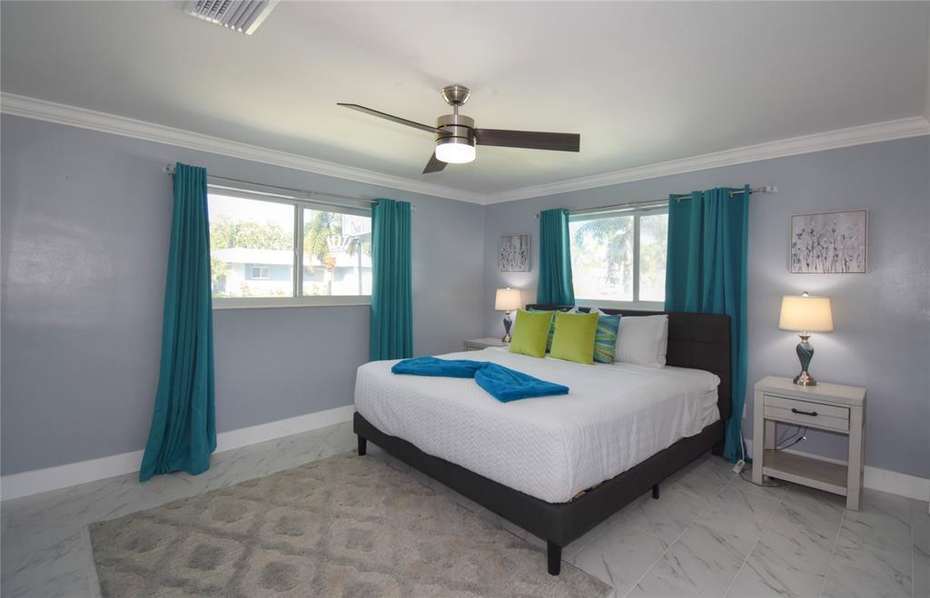 214 Southeast 5th Street Dania Beach, FL 33004 - Photo 28 of 50 a bedroom with a bed and window