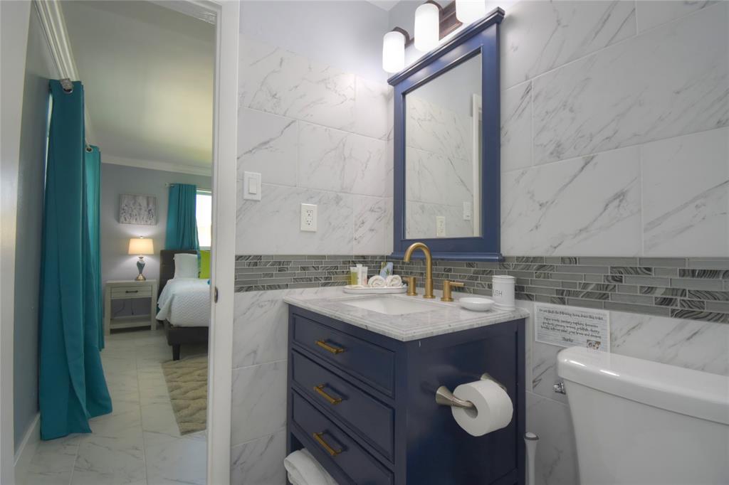 214 Southeast 5th Street Dania Beach, FL 33004 - Photo 34 of 50 a bathroom with a sink and a mirror