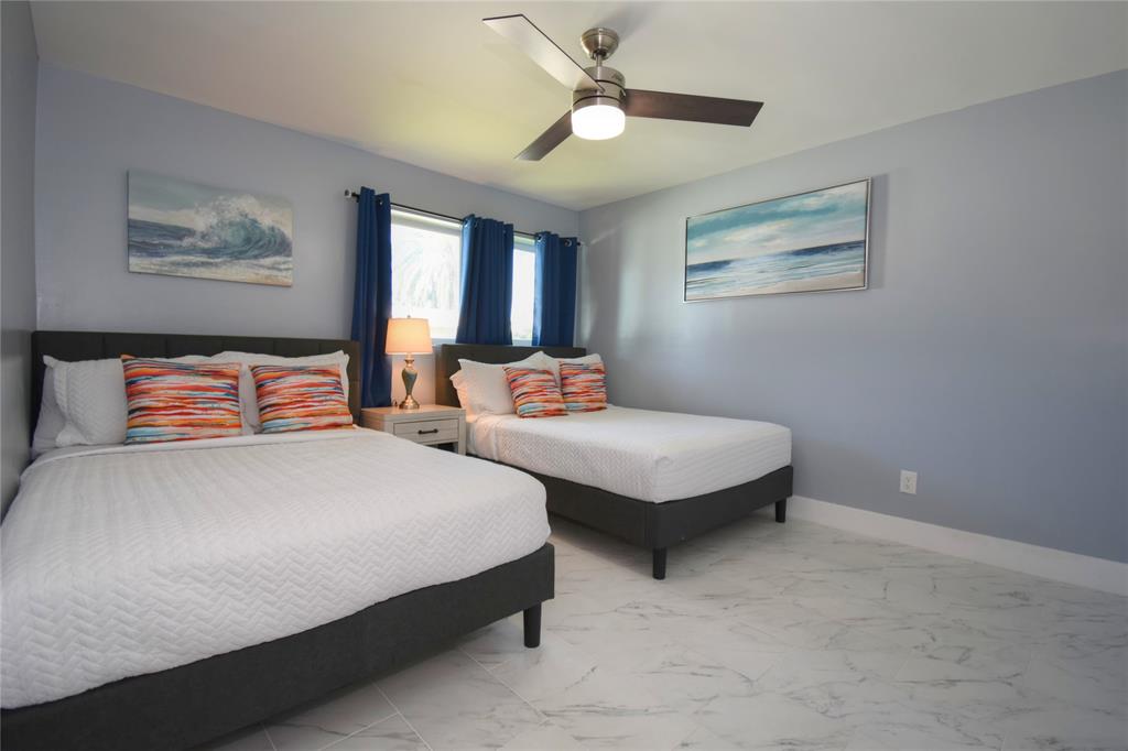 214 Southeast 5th Street Dania Beach, FL 33004 - Photo 36 of 50 a bedroom with two beds and painting on the wall