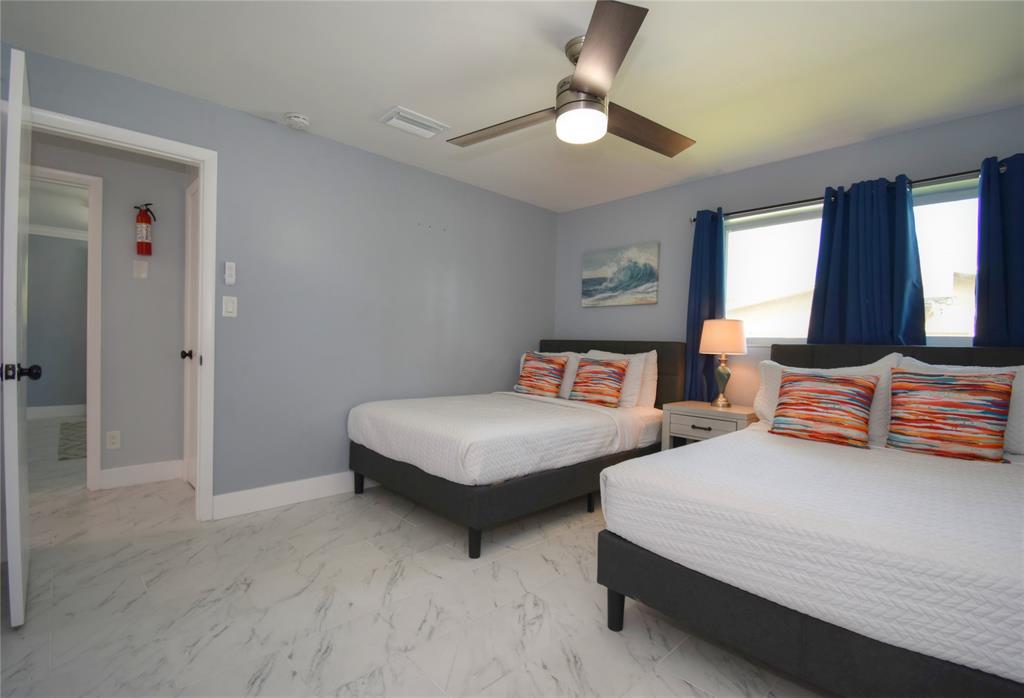 214 Southeast 5th Street Dania Beach, FL 33004 - Photo 37 of 50 a bedroom with two beds and painting on the wall