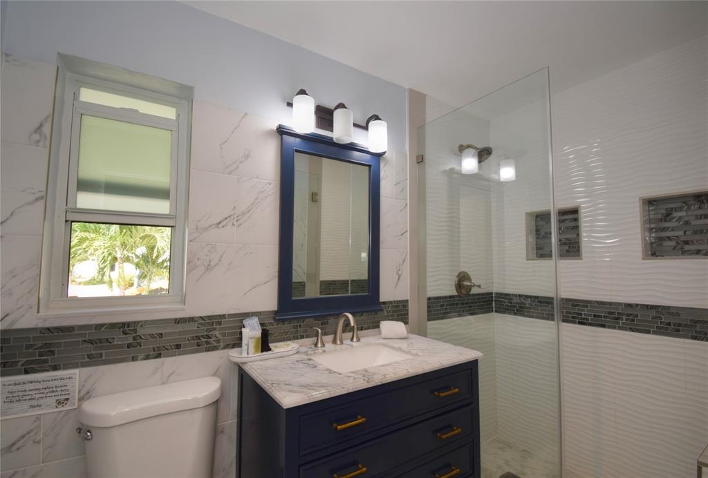 214 Southeast 5th Street Dania Beach, FL 33004 - Photo 42 of 50 a bathroom with a sink and a mirror