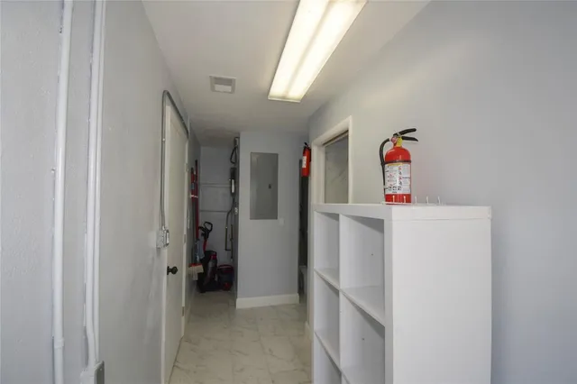 a view of storage and utility room with washer and dryer