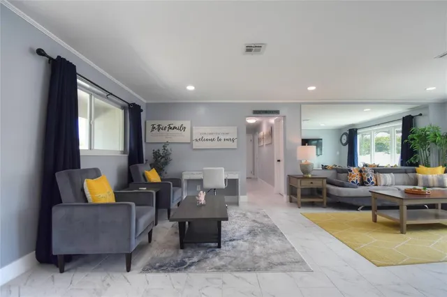 a living room with furniture and a couch