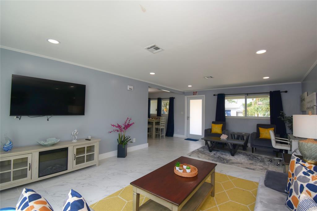 214 Southeast 5th Street Dania Beach, FL 33004 - Photo 9 of 50 a living room with furniture and a flat screen tv