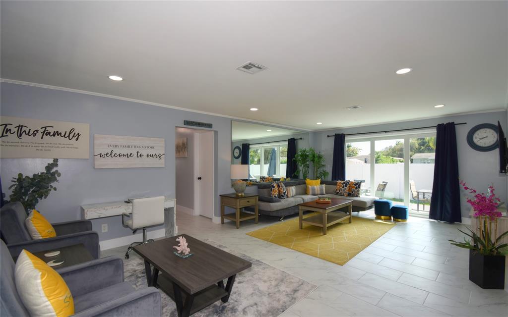 214 Southeast 5th Street Dania Beach, FL 33004 - Photo 10 of 50 a living room with furniture pool table and a large window