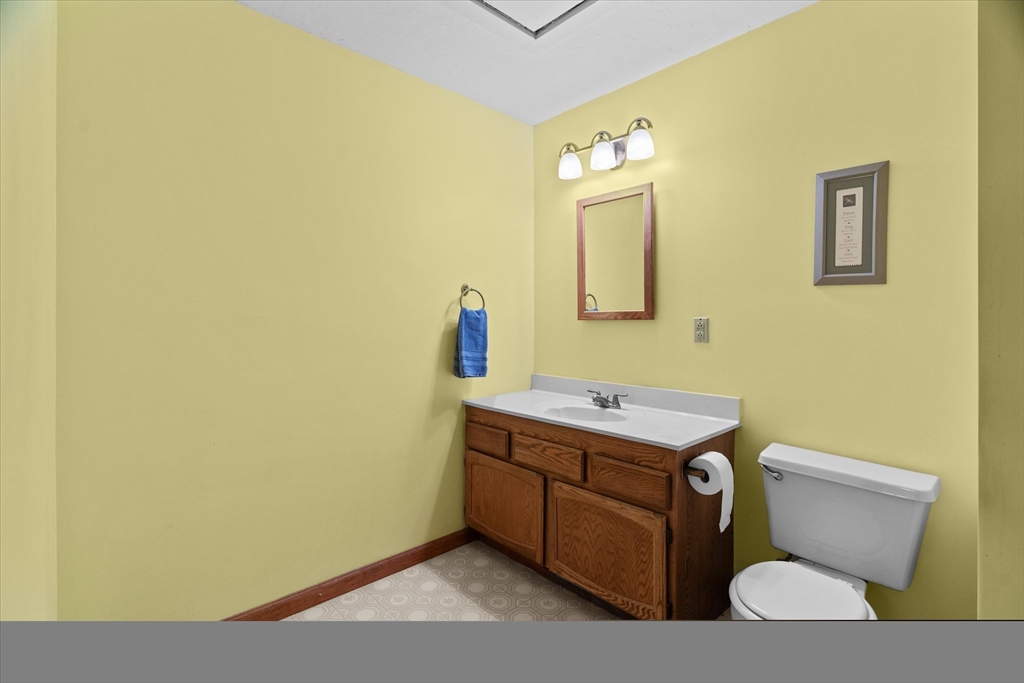 102 Valley Road Barre, MA 01005 - Photo 17 of 40 a bathroom with a toilet a sink and mirror