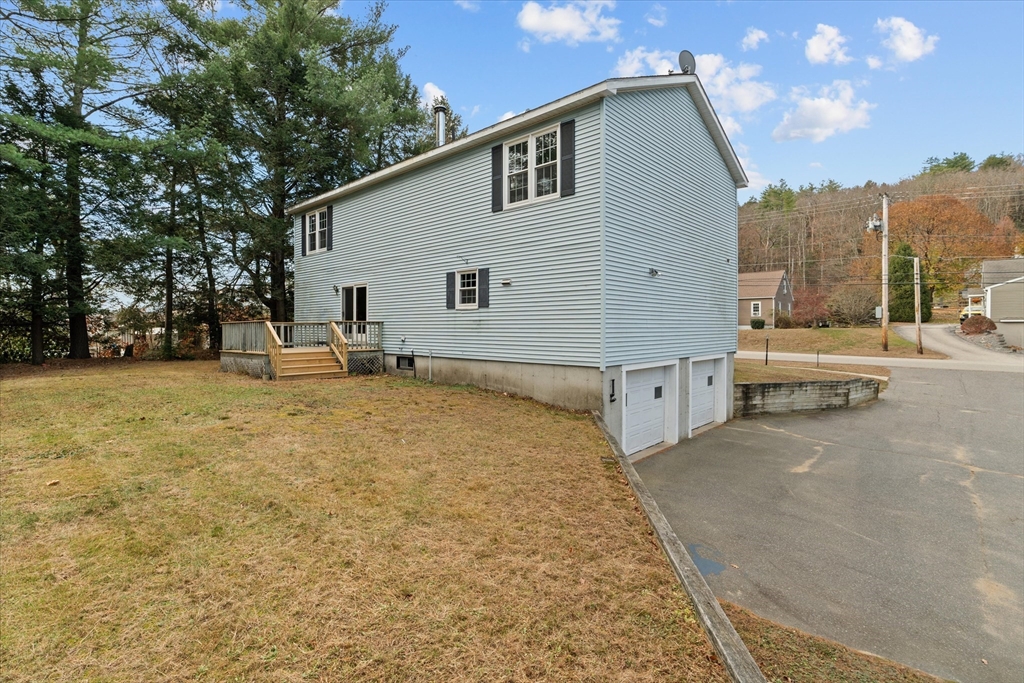 102 Valley Road Barre, MA 01005 - Photo 28 of 40 a backyard of a house with table and chairs