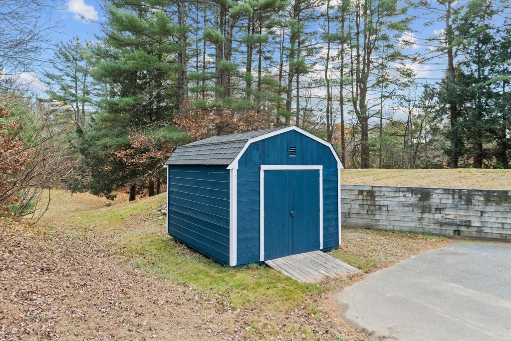 102 Valley Road Barre, MA 01005 - Photo 31 of 40 a view of wooden house and a yard with trees