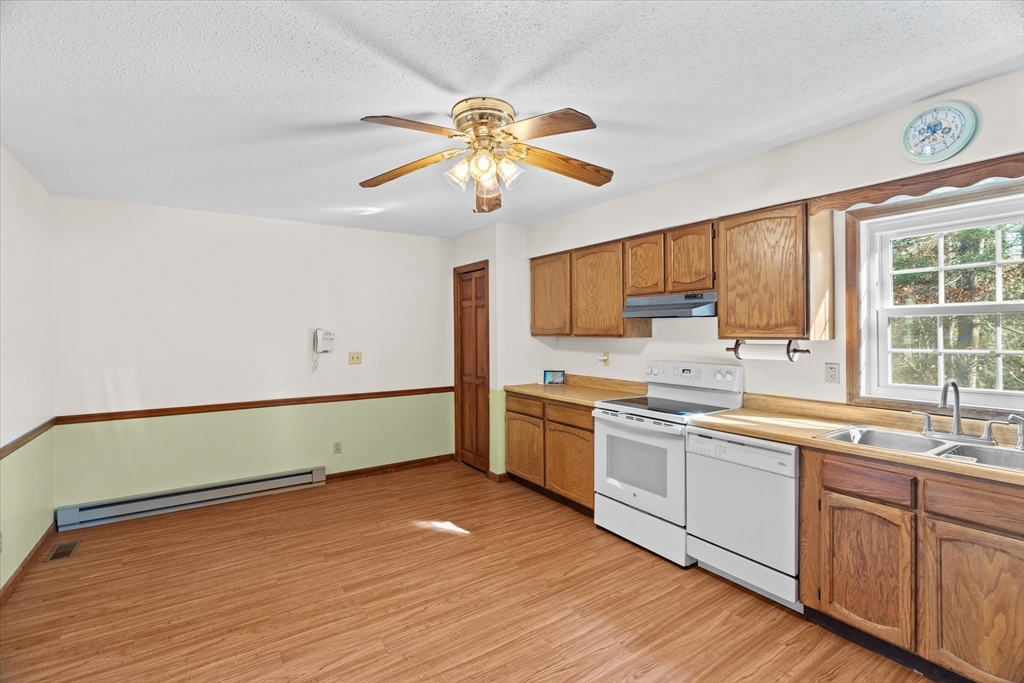 102 Valley Road Barre, MA 01005 - Photo 4 of 40 a kitchen with a sink cabinets and window