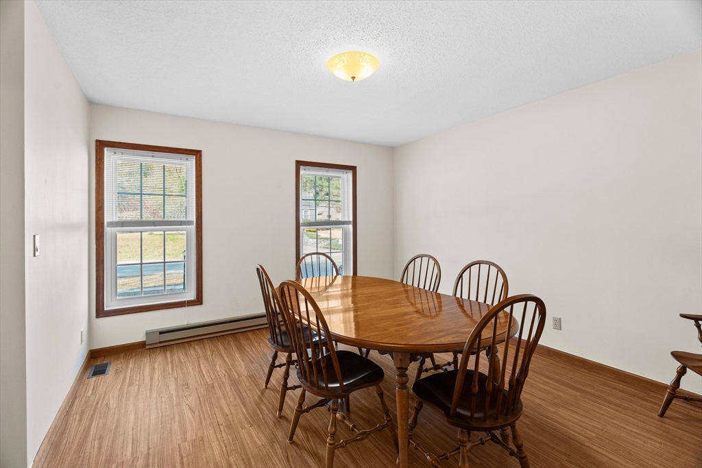 102 Valley Road Barre, MA 01005 - Photo 6 of 40 a view of a dining room with furniture and wooden floor