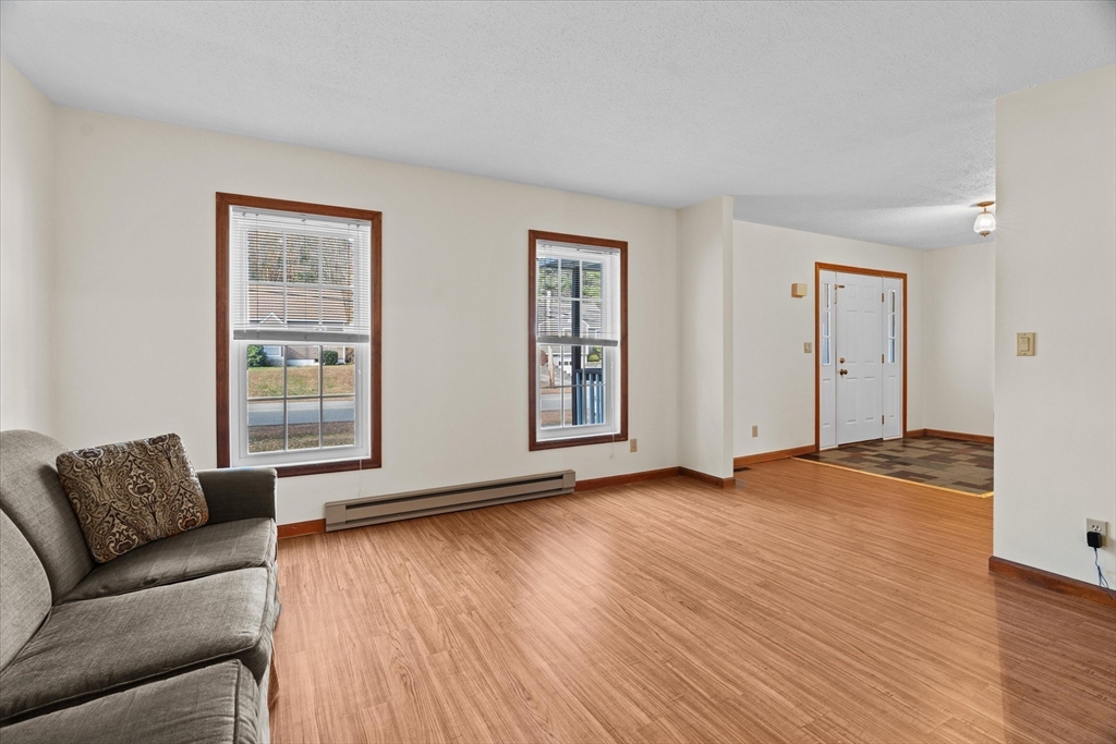 102 Valley Road Barre, MA 01005 - Photo 9 of 40 a view of livingroom with furniture and wooden floor